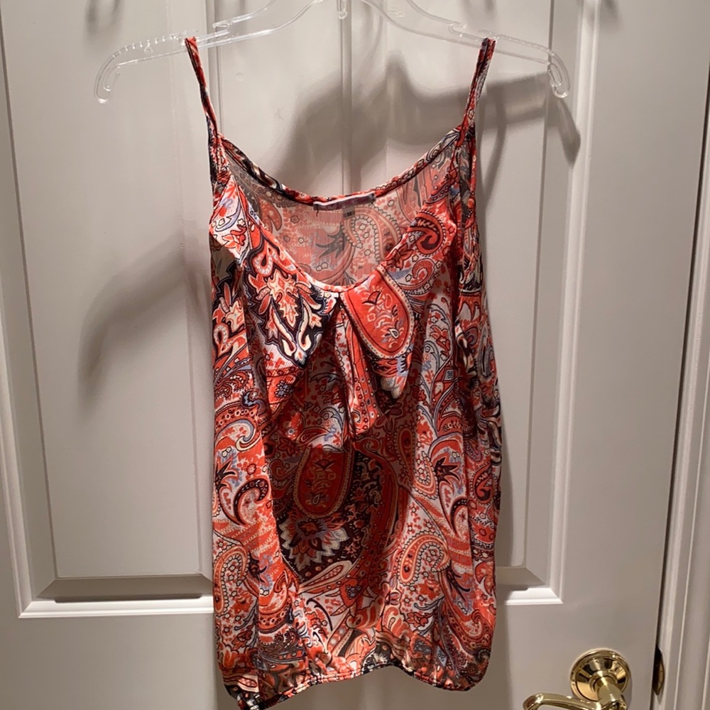 orange ruffle pattern tank with blue and black swirls. medium